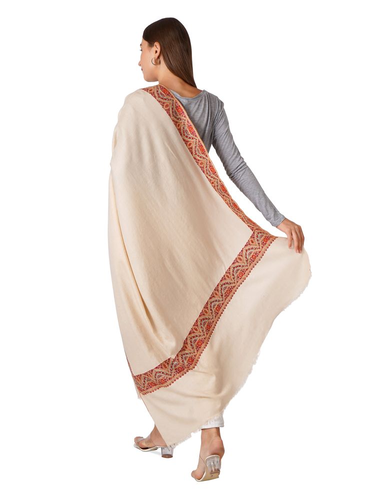 Experience unparalleled elegance with our Stylish Pashmina Shawl, designed to envelop you in luxury and sophistication. This exquisite shawl is perfect for elevating any outfit, making it an essential accessory for your wardrobe. Product Details: Hand Embroidered Pure Kashmiri Pashmina Material: Pure Pashmina (100% Cashmere) Size: 100 cm X 203 cm / 40 Inch X 80 Inch / 1.1 x 2.2 Yards (Approx) Base Color: Off White Embroidery: Intricate border embroidery in contrasting hues Craftsmanship: Handwov Elegant Cutdana Shawl, Luxury Embroidered Festive Traditional Wear, Cream Dupatta Shawl, Elegant Semi-stitched Shawl With Traditional Drape, Elegant Dupatta With Border In Traditional Drape, Beige Pashmina Shawl Dupatta For Wedding, White Pashmina Dupatta, Traditional Drape Pashmina Shawl With Cutdana, Cream Pashmina Dupatta For Wedding