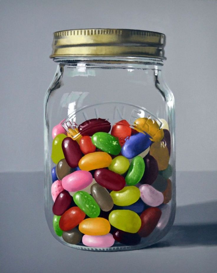 a glass jar filled with lots of colorful candy