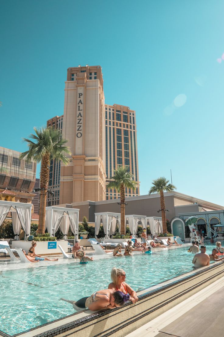 people are relaxing in the swimming pool at caesaro casino and resort, las vegas