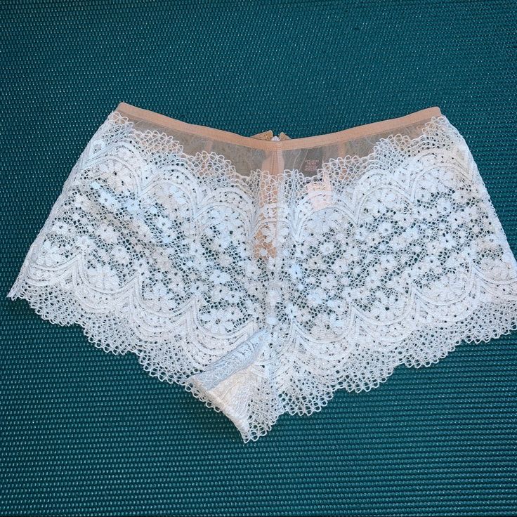 Delicate Lace Brief Bottoms For Summer, White Fitted Brief Shorts, Fitted White Brief Shorts, Victoria's Secret Lace Bottoms For Summer, White Stretch Lace Shorts, White Lace Loungewear Bottoms, Victoria's Secret White Bottoms With Lace Trim, Victoria's Secret White Lace Trim Bottoms, Victoria's Secret White Summer Shorts