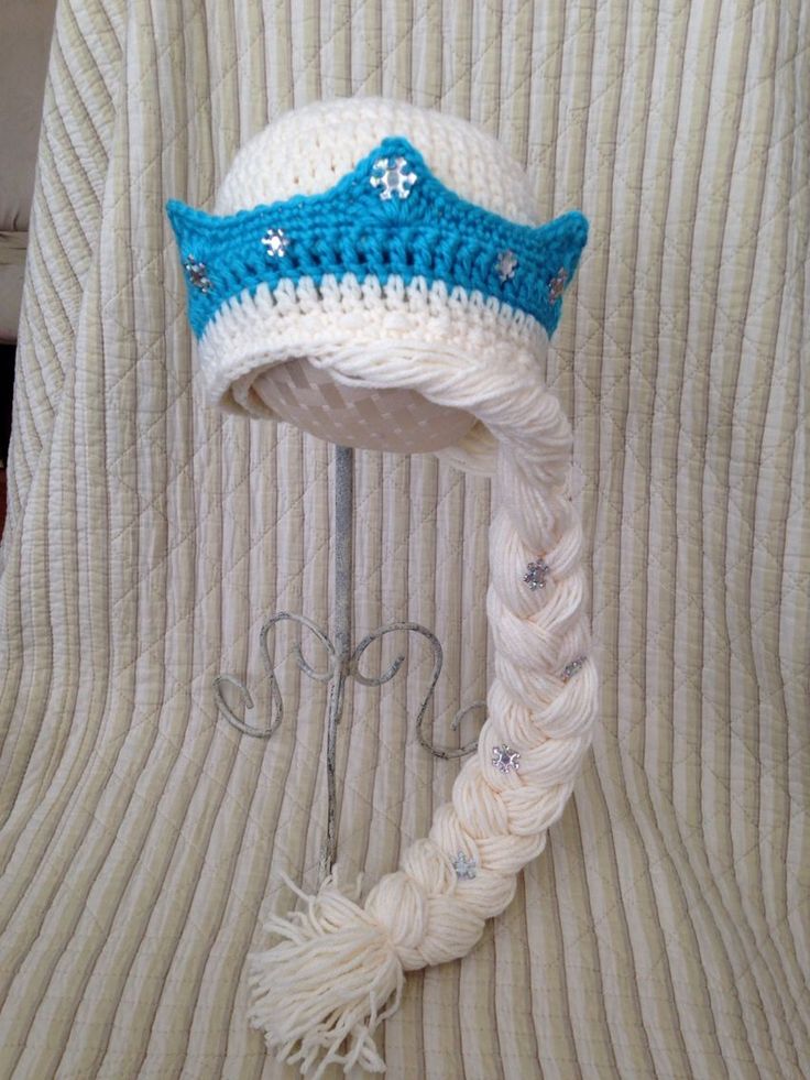 a white and blue hat sitting on top of a table