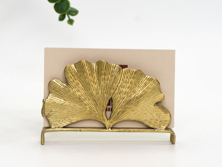 a card with a gold scallop design on it