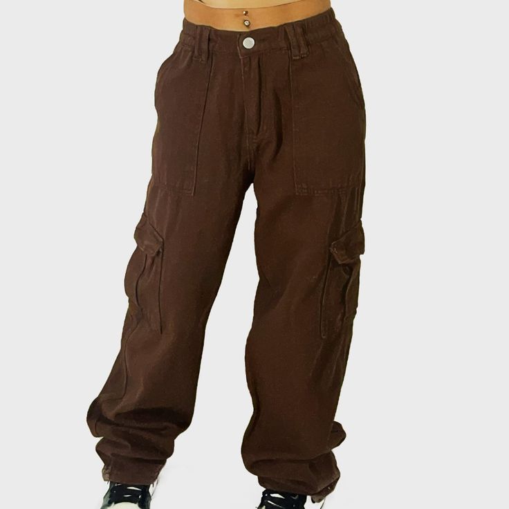 Brown Cargo Pants With A Straight Leg And Added Pockets For A Stylish And Full Functioning Pant. Brown High Waist Relaxed Fit Bottoms, Trendy Baggy Brown Bottoms, Trendy Baggy Brown Cargo Pants, Trendy Brown Baggy Cargo Pants, Trendy Brown Cotton Pants, Mid-rise Brown Pants For Streetwear, High Waist Brown Bottoms For Streetwear, Mid-rise Brown Bottoms With Cargo Pockets, Brown Baggy Cargo Style Bottoms