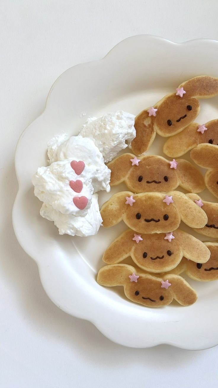 a white plate topped with cookies and marshmallows