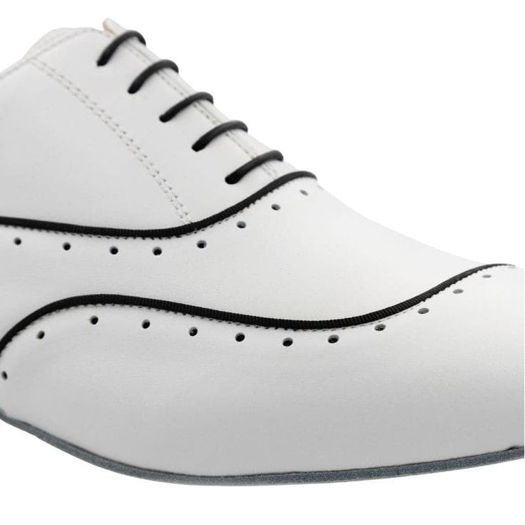 Softest white leather with a black trim detail. The five eyelet lace-up design will keep you securely in the shoe during a full range of motion. Natural leather Cushioned anti-inflammatory "No More Pain" insole Shock absorbing 2.20mm rubber heel Non-slip buffalo suede outsole Satin bag with two separate compartments Imported from Italy *We make every effort to provide accurate product images. Actual colors may vary due to your device screen settings, lighting conditions during image taking, and Classic White Lace-up Leather Shoes, White Plain Toe Lace-up Shoes For Derby, Classic Lace-up Leather Shoes With Rubber Heel Cap, Modern White Lace-up Shoes With Rubber Sole, White Fitted Wingtip Oxfords, Classic White Sneakers With Elastic Laces, White Sporty Leather Lace-up Shoes, Fitted Leather Lace-up Shoes With Rubber Sole, Fitted White Leather Shoes With Plain Toe