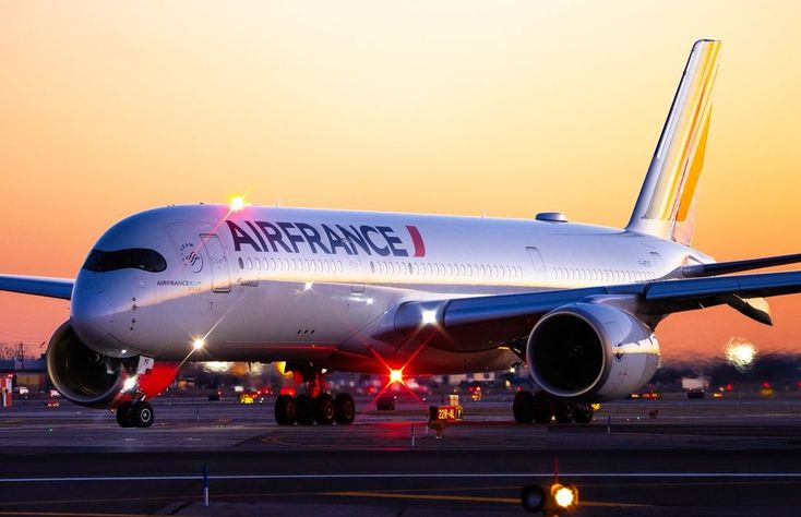 an airfrance airplane on the runway at sunset