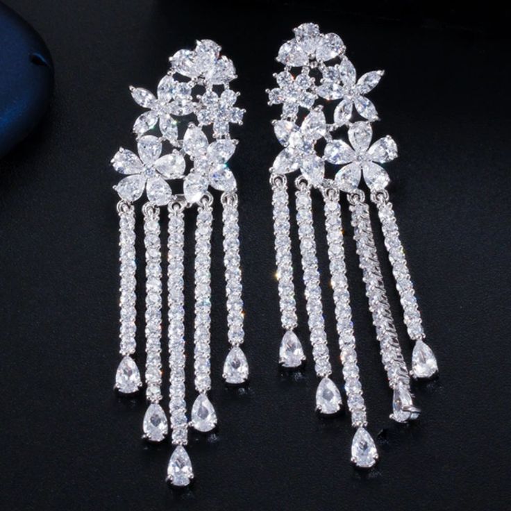 Brand New High Quality Zirconia Long Flower Tassel Earrings. I Have Only Silver Available. * Main Stone: Zircon * Metal: 925, Sterling * Earring Size: 6 Cm * Stone Quality Aaa * Quality: Gorgeous, Fashion, Luxury Please Comment For Any Questions :) White Cubic Zirconia Chandelier Earrings Gift, White Cubic Zirconia Flower Earrings For Formal Occasions, Formal White Flower Earrings In Cubic Zirconia, Formal White Flower Earrings With Cubic Zirconia, Formal White Cubic Zirconia Flower Earrings, Formal Dangle Flower Earrings With Cubic Zirconia, White Dangle Chandelier Earrings With Cubic Zirconia, Cubic Zirconia Dangle Flower Earrings For Party, Formal Bridal Earrings With Cubic Zirconia In Flower Shape