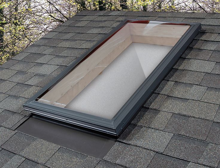 an open skylight on the roof of a house