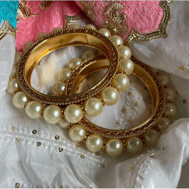 Bracelets/Bangles Condition: Good Color: White/Gold Size: 2.4 Product Includes: 1 Pair (2) As Shown In The Pictures This Item Is Matchable With Any Outfit Comes As Shown In The Pictures Message For Inquiries White Beaded Bracelets For Festive Occasions, White Beaded Bangle Bracelets For Festive Occasions, Elegant White Bracelets For Festive Occasions, Elegant White Bangle For Party, Traditional Cream Jewelry For Gifts, Adjustable White Bangle For Festive Occasions, White Stackable Beaded Bracelets For Wedding, White Pearl Bracelet For Festive Occasions, White Adjustable Bracelets For Festive Season