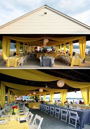 an outdoor dining area with tables and chairs covered in yellow drapes