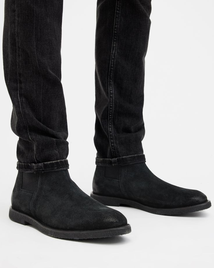 For casual occasions, step out in the Rhett Boots, crafted from soft suede and finished with a crepe rubber outsole. Shaped to a traditional Chelsea boot shape.  These boots fit true to size Round toe Ankle boot Pull tab Chelsea boots Elasticated gusset AllSaints 01-11-94 stamp Casual Black Suede Chelsea Boots, Casual Leather Chelsea Boots With Textured Sole, Suede Chelsea Boots With Moc Toe And Suede Lining, Classic Suede Chelsea Boots With Moc Toe, Suede Chelsea Boots With Moc Toe, Casual Leather Chelsea Boots With Moc Toe, Suede Ankle Boots With Vibram Sole, Suede Chelsea Boots With Leather Footbed, Suede Chelsea Boots With Plain Toe