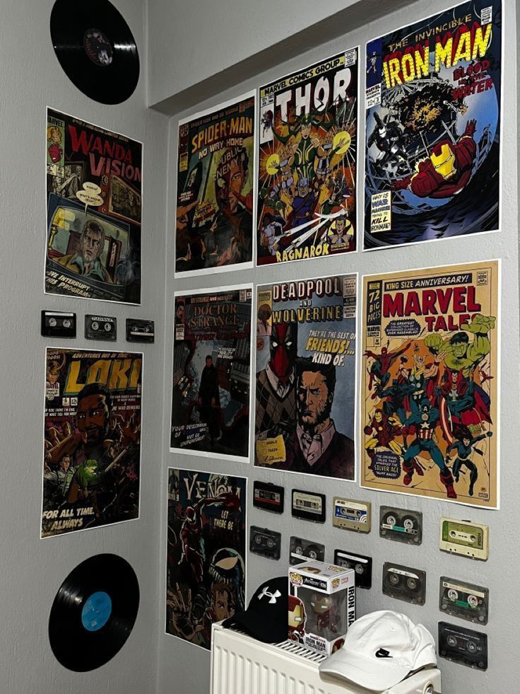 there are many comics on the wall in this room