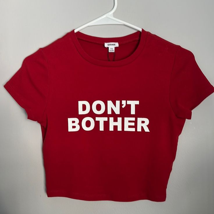 Never Worn Red Slogan Top For Summer, Fitted Red Slogan T-shirt, Red Fitted Letter Print T-shirt, Fitted Red T-shirt With Text Print, Fitted Red T-shirt With Letter Print, Trendy Red Slogan Top, Fitted Red Slogan Top, Red Graphic Tee With Text Print, Red Graphic Tee With Letter Print