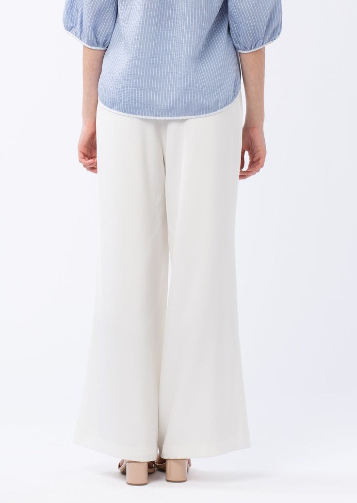 *This item eligible for store credit only.* These drapey trousers are the perfect piece to polish off your warm weather wardrobe. Crafted of soft crepe and fully lined, these trousers zip up the side to give you a flattering, clean silhouette. The Carter Trousers are finished with a thick high waistband and faux welt pockets in the back. Complete the look with the Anna Top. Classic fit : we recommend taking the next size up if in between sizes Inseam length 32 1/2" Faux back pockets Side waist i Chic Wide-leg Viscose Pants, Workwear Wide-leg Viscose Pants, Viscose Wide-leg Workwear Bottoms, Viscose Wide-leg Workwear Pants, Viscose Wide-leg Pants For Work, Versatile High-waisted Viscose Pants, Chic High-waisted Viscose Pants, Stretch High-waisted Viscose Pants, Solid Viscose Trousers