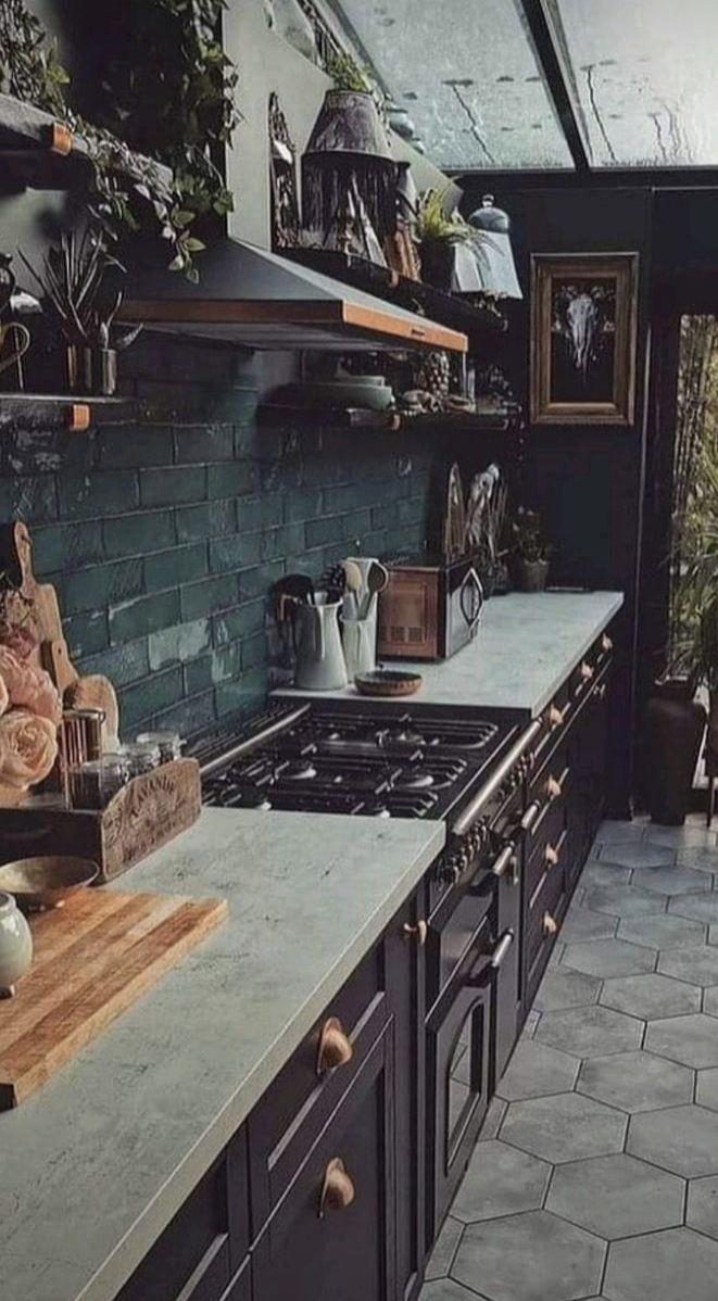 a kitchen with an oven, sink and counter top