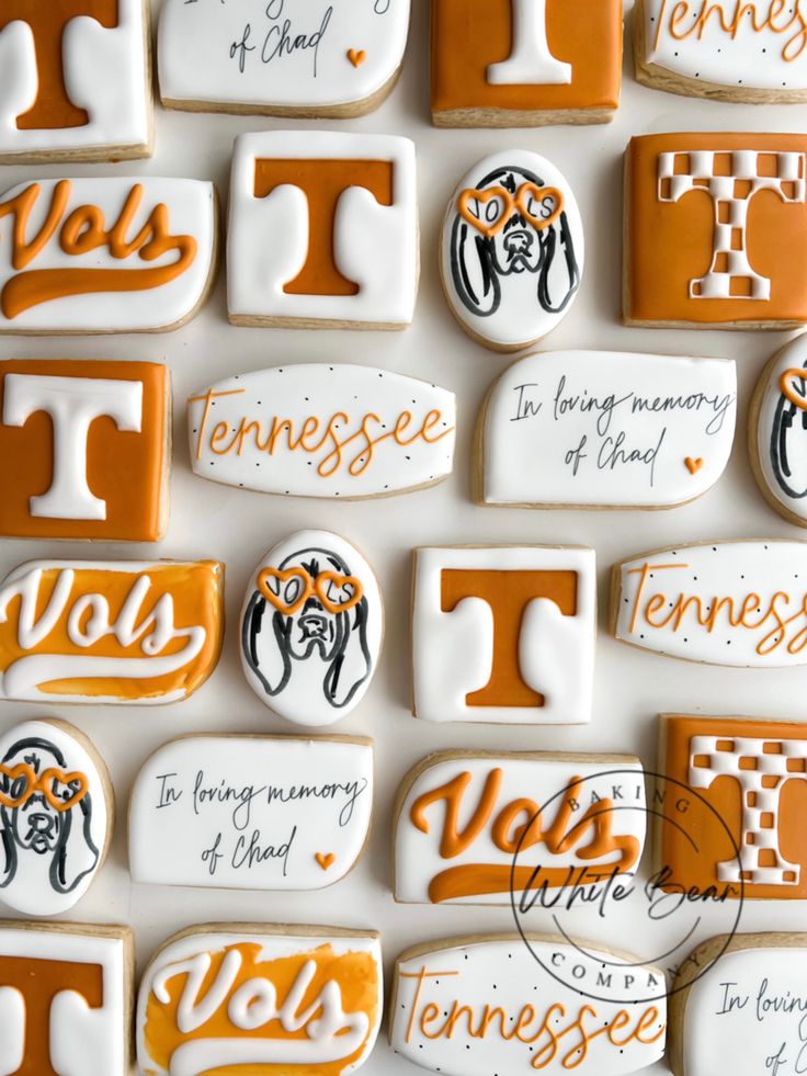 decorated cookies are arranged in the shape of letters