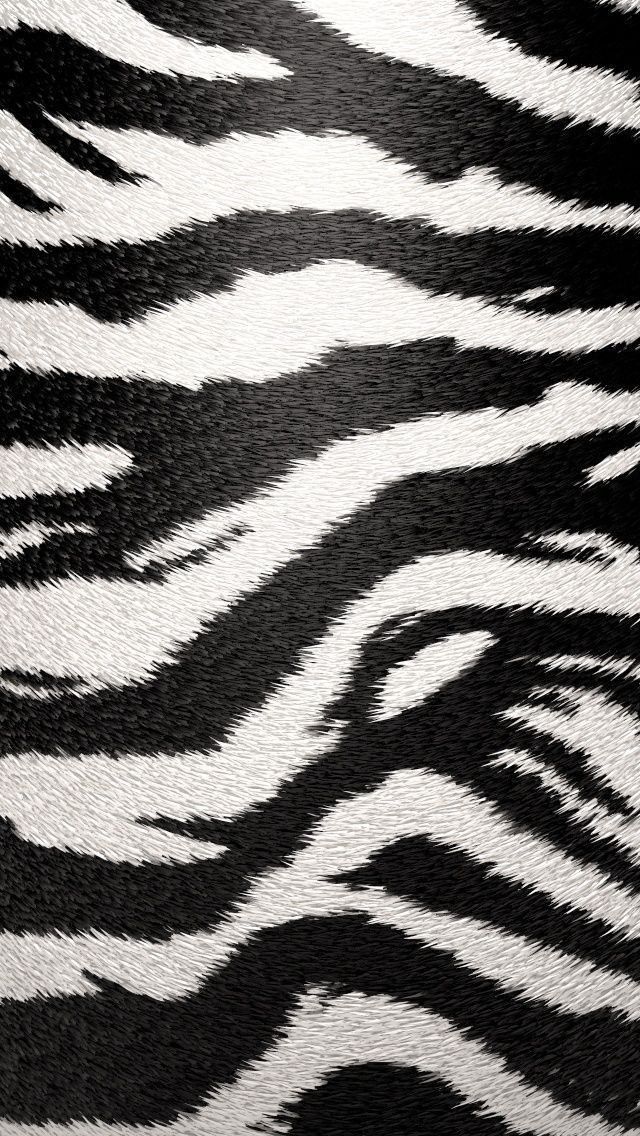 an animal print fabric with black and white stripes on it's side, showing the pattern