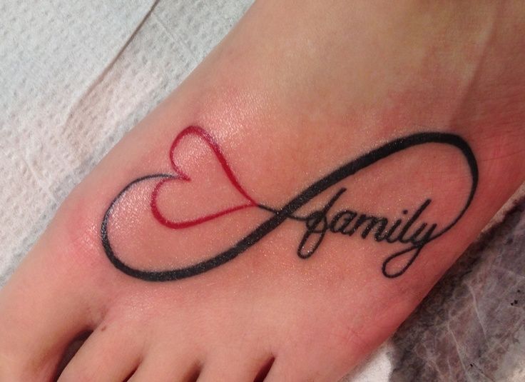 a foot with a heart and the word family written in cursive writing on it