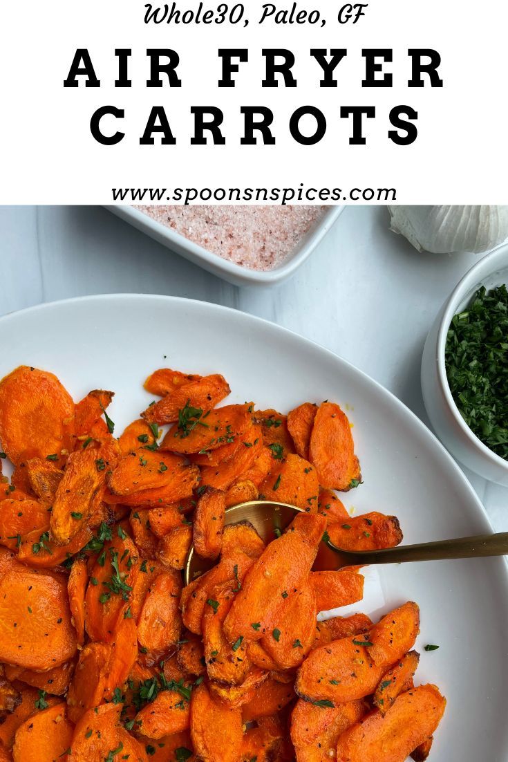 a white plate topped with sliced carrots and parsley