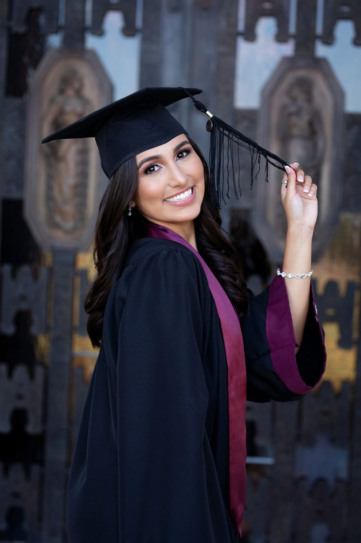 a woman wearing a graduation cap and gown