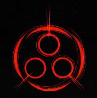 an orange and black logo with three circles in the center, on a black background