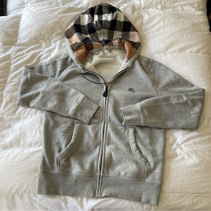 A Classic Mens Burberry Hooded Cardigan Gray Color With The Signature Nova Check Lined Hood Lining Hooded Neck Tips Are Embossed With The Burberry Name Size L- Working Front Pockets And Embroidered Burberry Logo At Chest Never Worn Burberry Zip Up Hoodie, Burberry Aesthetic, Burberry Clothes, Jean Hoodie, Best Hoodies For Men, Burberry Hoodie, Zipper Outfit, Burberry Fashion, Burberry Style