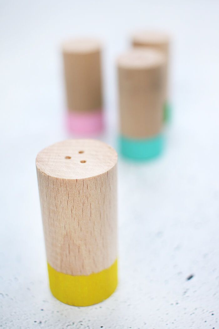 three wooden pegs sitting next to each other on top of a white countertop