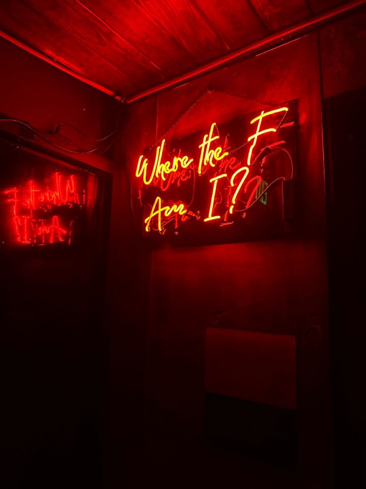 there is a neon sign that says where the f are i? in red light