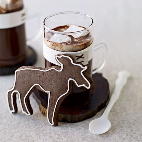 two mugs with hot chocolate and marshmallows in the shape of horses