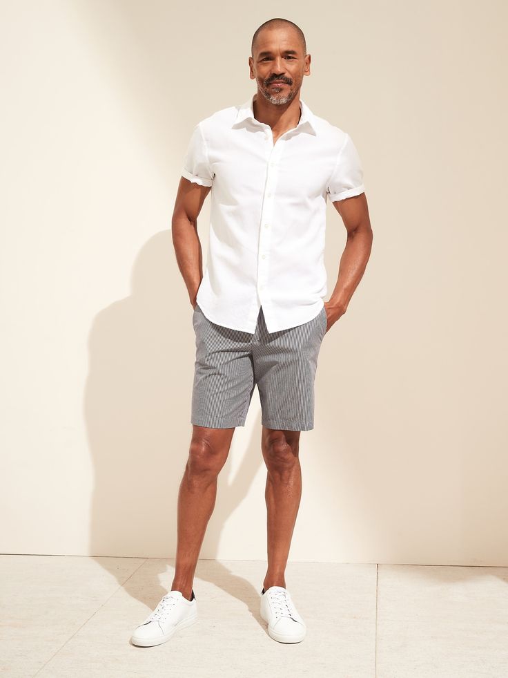 SOFT CHINO: A soft chino fabric made with a mix of organic and conventionally grown cotton.  Zip fly with button closure.  Front and back pockets.  Mid-rise.  Slim fit.  Inseam: Regular 9" Model: Size 32x32, 6'2" (188cm). Men’s Business Casual Outfits Summer, Men's Casual Outfits Shorts, Relaxed Fit Cotton Chinos For Everyday, Casual Cotton Relaxed Fit Chinos, Casual Relaxed Fit Cotton Chinos, Everyday Relaxed Fit Cotton Chinos, Relaxed Fit Casual Chinos With Button Closure, Relaxed Fit Cotton Chinos For Business Casual, Casual Relaxed Fit Chinos With Button Closure