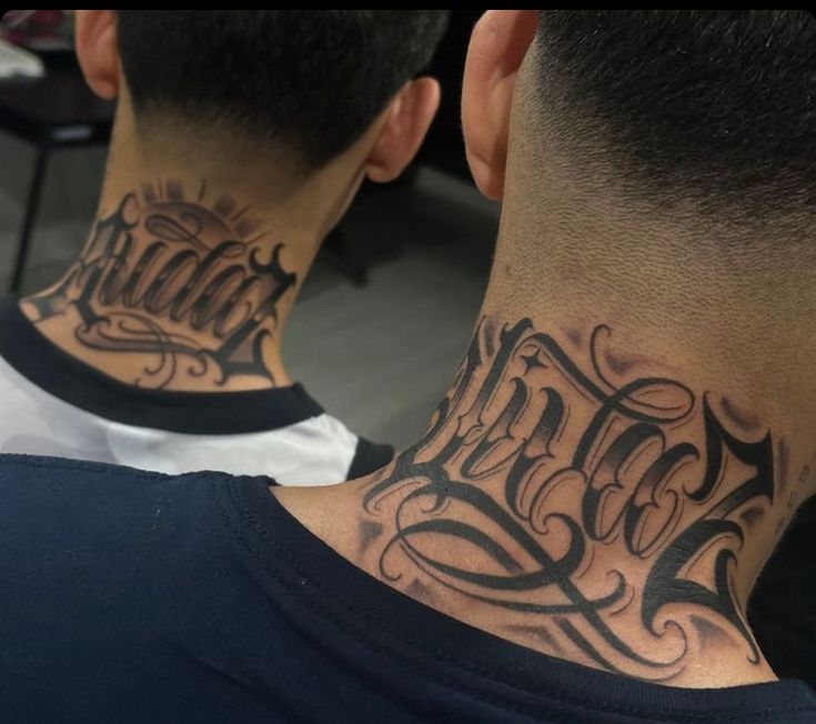 two men with tattoos on their neck, one has the word faith written in cursive font