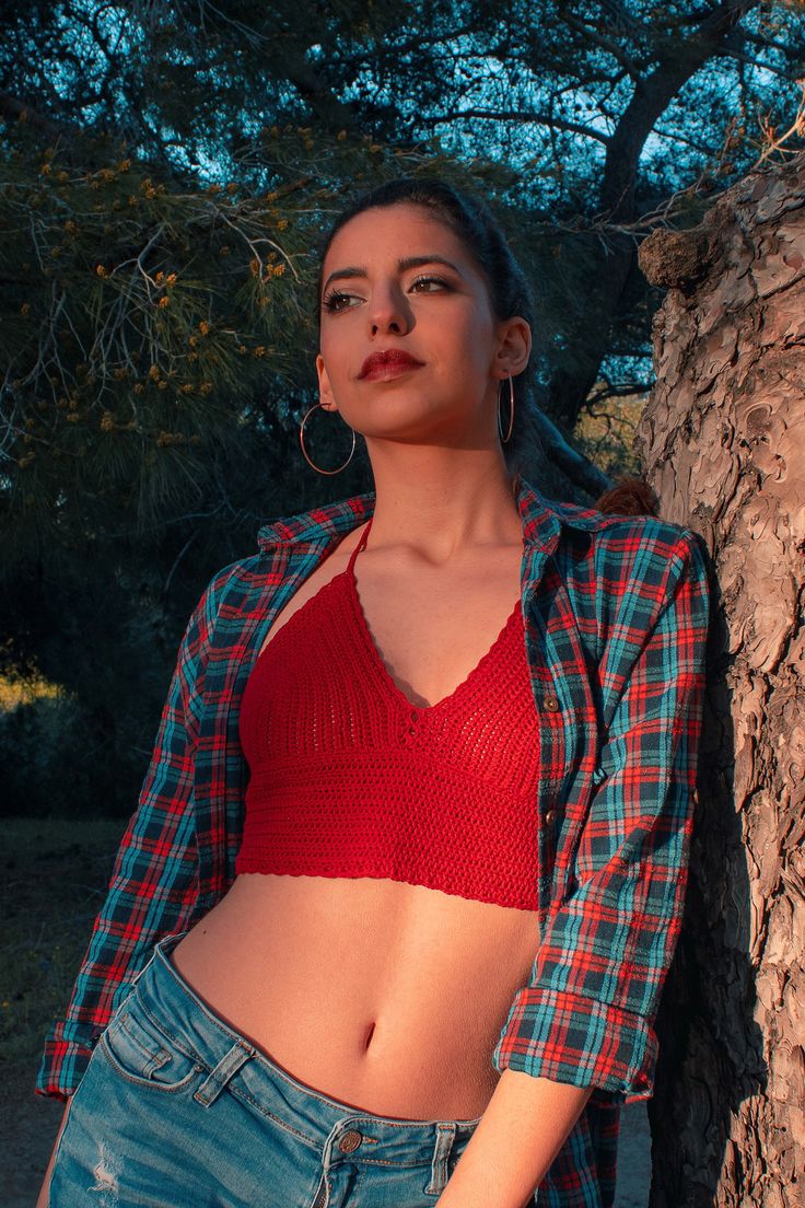 This red crochet crop top - bralette is the perfect outfit for festival goer, beachwear and summer days. If you want to be unique in your boho chic style, then choose this bralette. This crochet crop top has an adjustable halter design, adjustable ties on neck and back. YARN: 100% pure cotton. COLOR: Can be customized. SIZE: The measurement table is at the end of the photos. If you have any questions about what size to choose please contact me and I will gladly guide you to choose the correct si Fitted Hand Knitted Tops For The Beach, Red Triangle Top For Festival, Fitted Bohemian Knitted Top, Casual Crochet Halter Neck Tops, Casual Crochet Lace Triangle Top, Red Fitted Crochet Lace Top, Fitted Bohemian Hand Knitted Top, Casual Fitted Hand Knitted Top, Casual Fitted Hand-knitted Tops