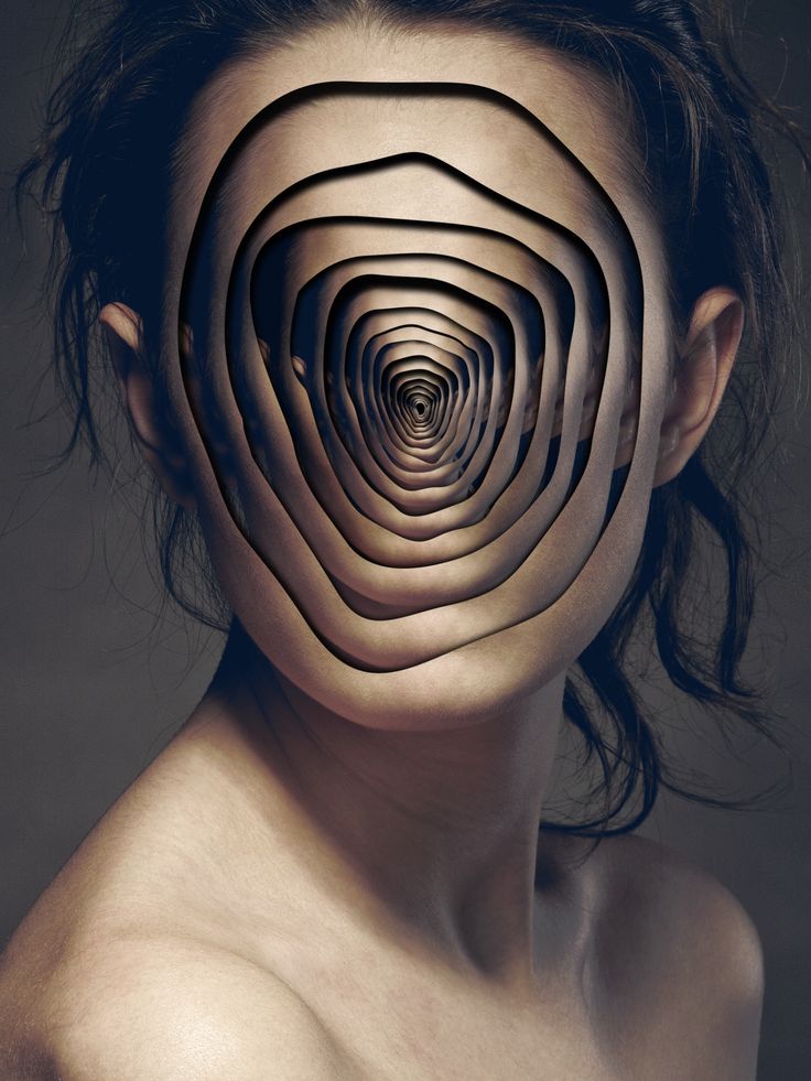 a woman's face with an intricate pattern on her body and the image is shaped like a spiral