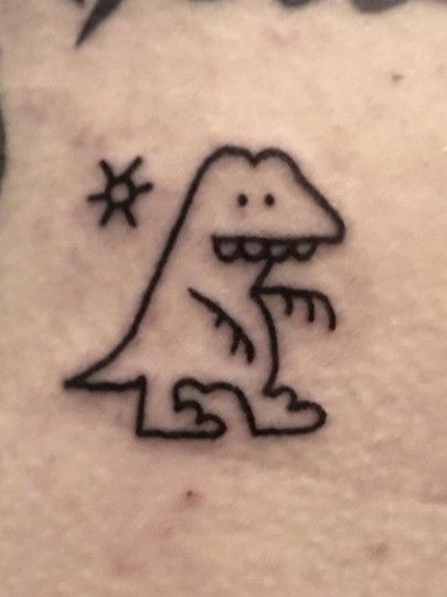 a drawing of a dinosaur on the back of a woman's stomach, with stars in the background