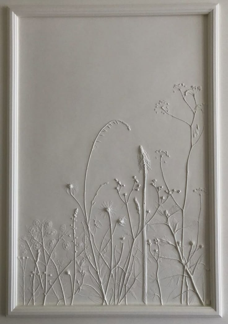 a white frame with some flowers on it