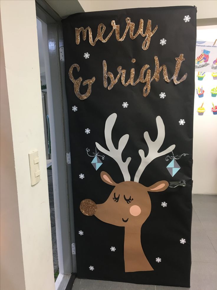 a door decorated with gold foil and reindeer's head, merry and bright written on it