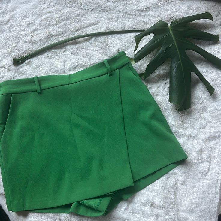 Zara Wrap Green Skort Sz-M Skort With A High Waist And Front Wrap. Front Pockets. Side Hidden In-Seam Zip Closure. Chic Green Shorts With Short Inseam, Green Short Bottoms For Work, Green Bottoms With Short Inseam For Workwear, Chic Green Shorts For Day Out, Green Zara Shorts For Spring, Zara Green Short Bottoms, Zara Green Shorts For Spring, Zara Green Shorts, Fitted Green Zara Shorts