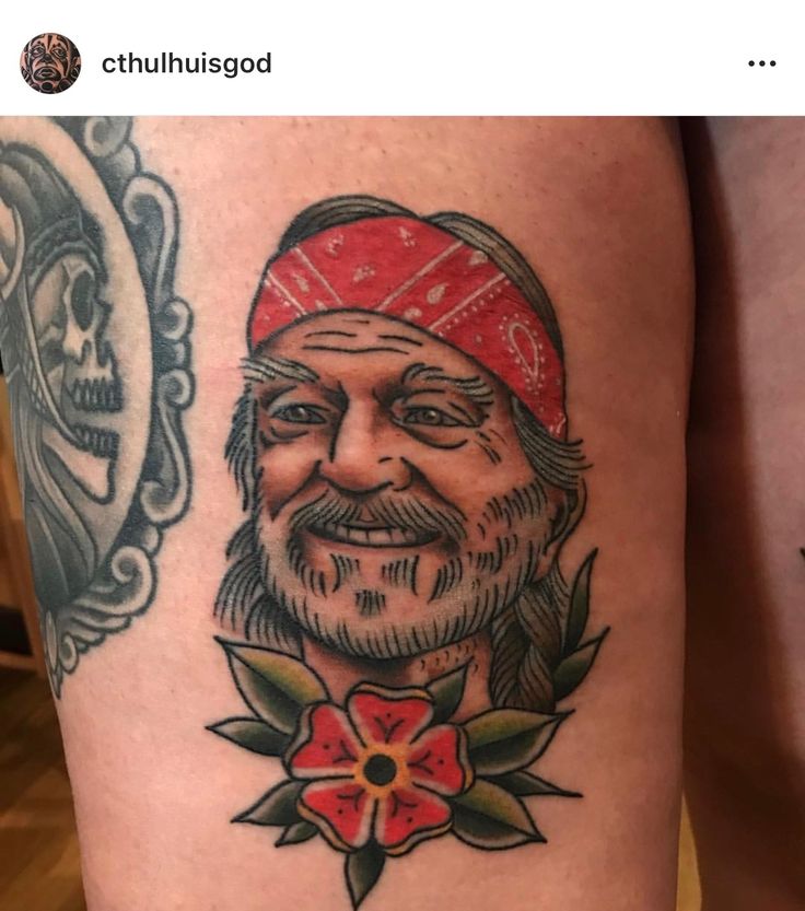 an old man with a beard and red bandana on his leg