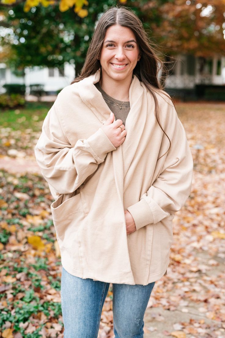 Introducing the Hadley Relaxed Cardigan – your new cozy essential. Crafted in a versatile neutral hue, this cardigan features an open front and an oversized, relaxed fit. It's the perfect blend of comfort and style, making it an ideal layer for any occasion. Embrace warmth and elegance with the Hadley Relaxed Cardigan. 95% Cotton, 5% Spandex. Sizing runs true. Model is shown wearing a small. Oversized fit. Side pockets. Open front. Oversized Taupe Sweater For Layering, Cozy Taupe Cardigan For Layering, Taupe Cozy Cardigan For Spring, Cozy Taupe Cardigan For Spring, Cozy Taupe Spring Cardigan, Versatile Soft Knit Relaxed Fit Cardigan, Cream Cardigan For Fall Layering, Long Sleeve Taupe Cardigan For Layering, Cream Open Front Cardigan For Fall