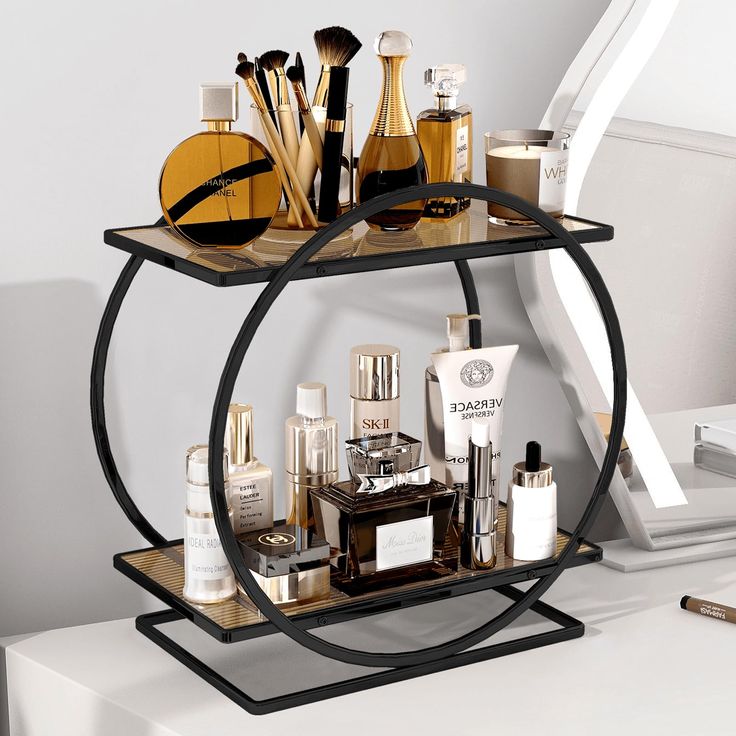 a black metal shelf with cosmetics and other items on it in front of a mirror