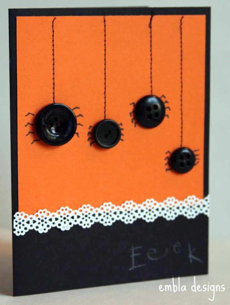 an orange card with black buttons and lace