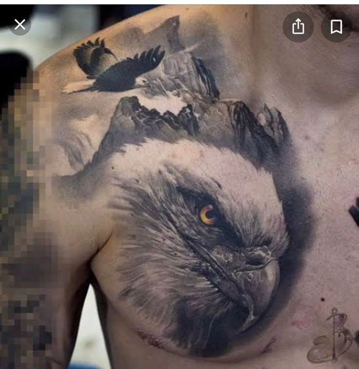 an eagle tattoo on the chest is shown