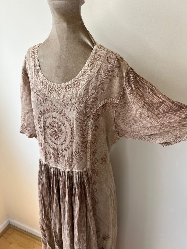 90's embroidered hippie dress. Loose fitting with a tie at the back of the waist. UK Size 12 - 14. Please check measurements: Chest - 102cm Waist - 94cm Length - 136cm Brown Hippie Boho Dress For Spring, Fitted Beige Peasant Dress, Brown Fitted Bohemian Dress, Beige Fitted Peasant Dress, Fitted Brown Bohemian Dress, Brown Fitted Bohemian Boho Dress, Fitted Brown Boho Dress, Spring Festival Brown Boho Dress, Fitted Hippie Dresses For Spring