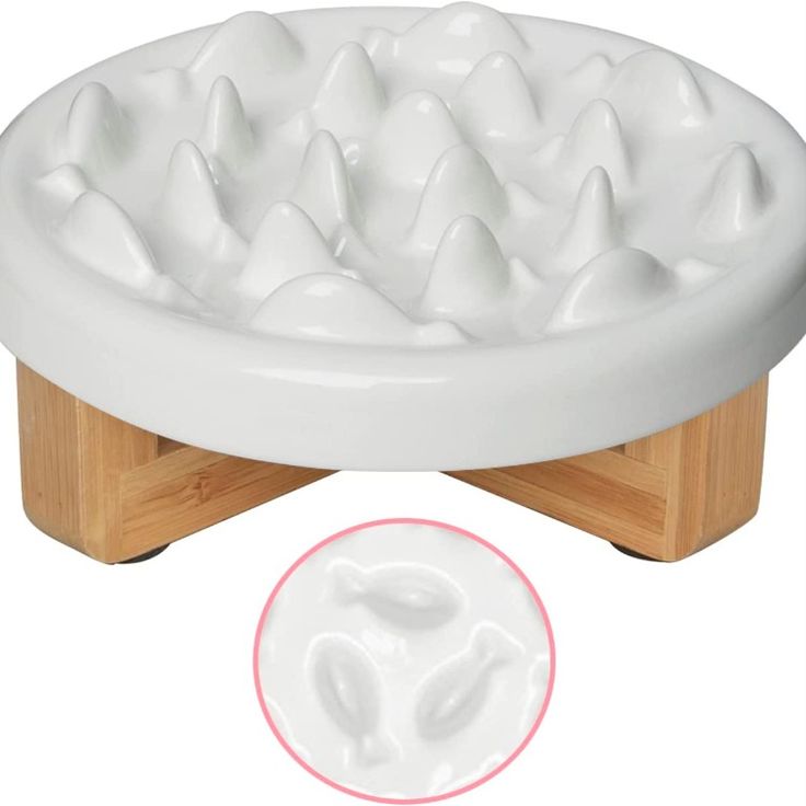 an image of a white dog toy on a wooden stand with the lid open and it's paw prints