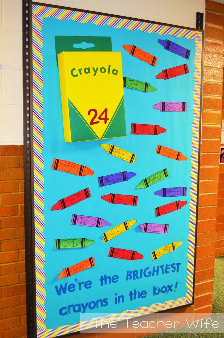 a bulletin board with crayons on it and the words crayola written in blue