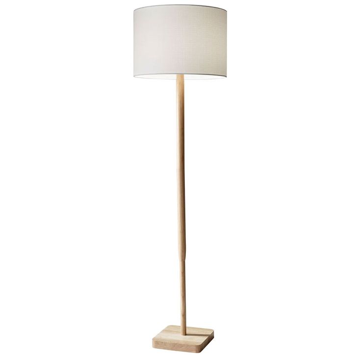 a wooden floor lamp with a white shade