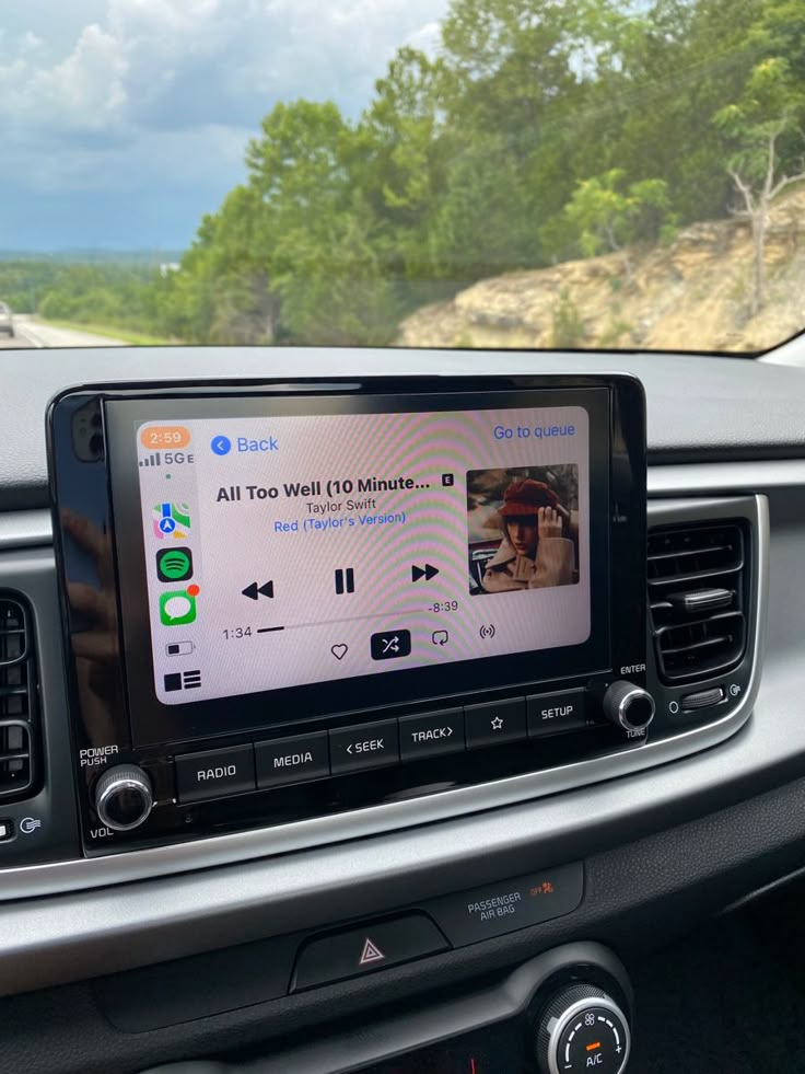 an image of a car dashboard with the radio in it's center and head up display