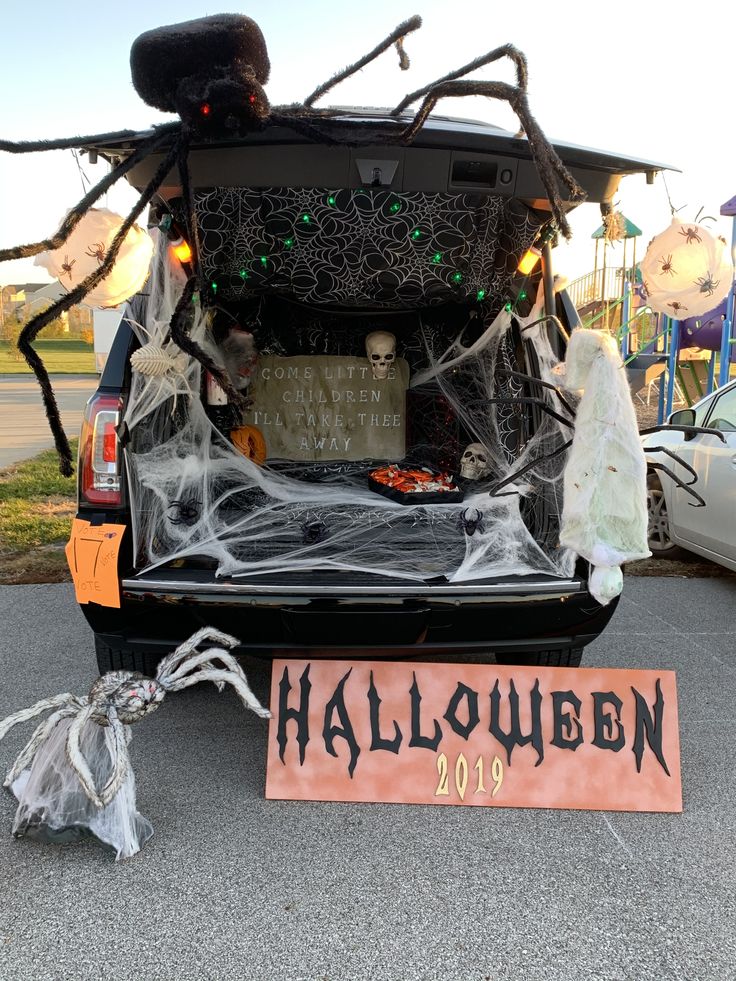 the trunk of a car decorated for halloween