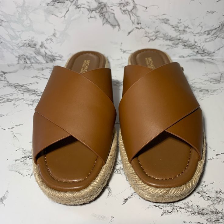 New And Never Used Linden Slides Brown Leather Sz 8 Michael Kors Slides Brown, Vacation Mules With Cushioned Footbed And Round Toe, Cushioned Round Toe Mules For Vacation, Platform Slip-on Mules For Vacation, Vacation Platform Slip-on Mules, Brown Flat Mules For The Beach, Spring Brown Mules For Beach, Brown Spring Beach Mules, Spring Beach Brown Mules