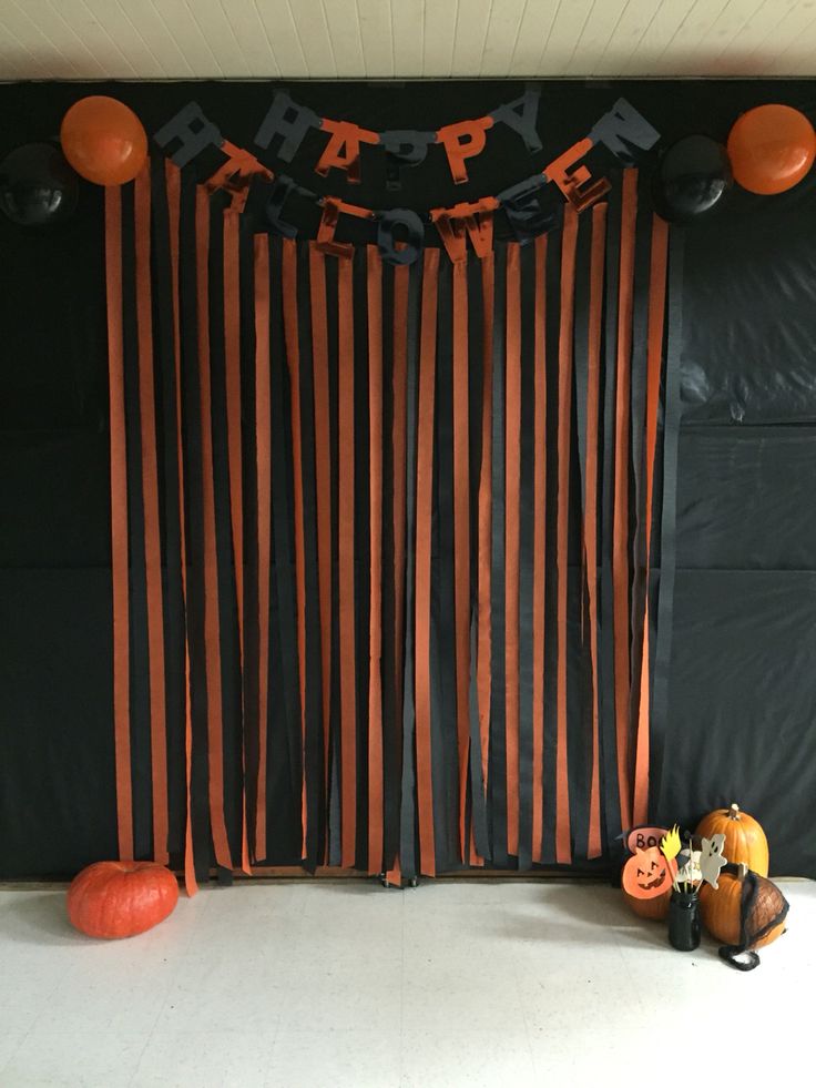 a black and orange halloween party with decorations